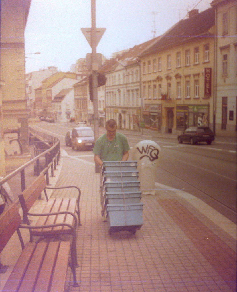 Chaika 3 (on redscale film) - Man with Boxes on Pekařská Street