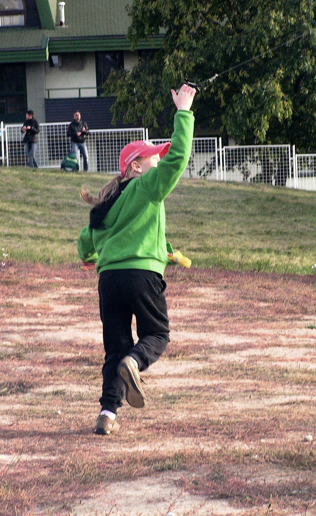 Girl in Green Flying the Kite 3