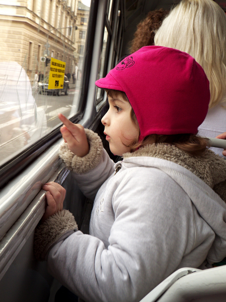 Little Girl Looking from Tram Window