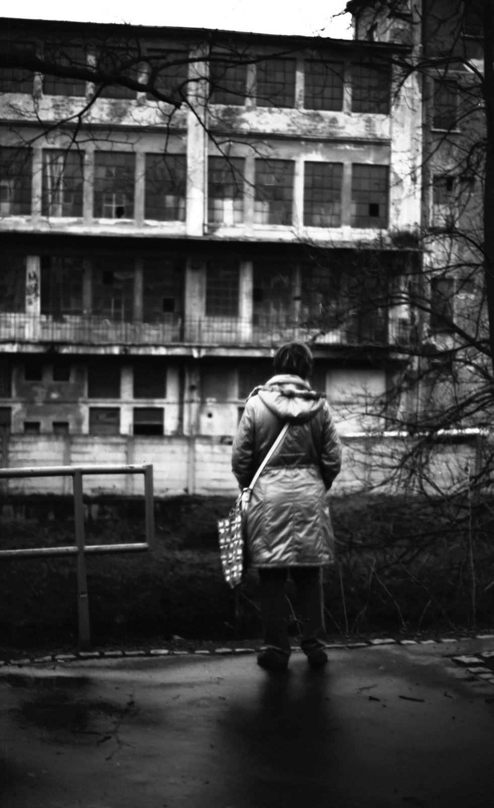 Canon Rebel XS + ORWO DP3 film - Woman Looking at Abandoned Factory