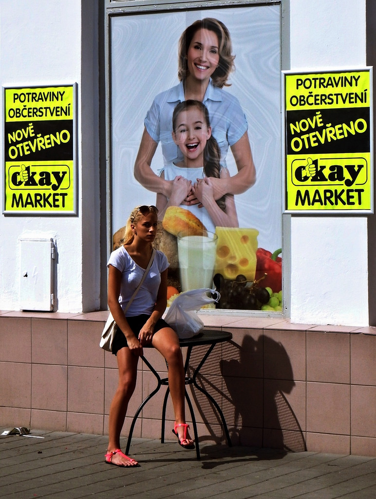 Young Woman in front of Newly Opened Shop