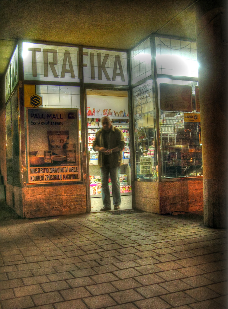 Man Leaving Tobacconist's (at Night)